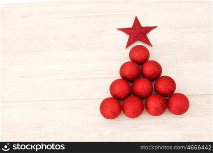 Christmas decorations arranged in tree shape. Red balls