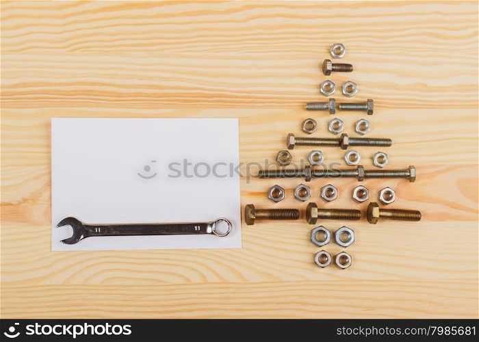 Christmas decorations - Christmas tree from hardware. Christmas decorations - Christmas tree from hardware on the wooden background