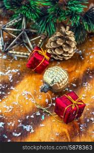 Christmas decorations. Festive Christmas decorations on wooden background in vintage style.Photo tinted.