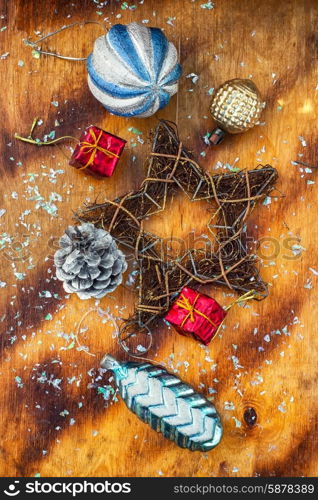 Christmas decorations. Festive Christmas decorations on wooden background in vintage style.Photo tinted.