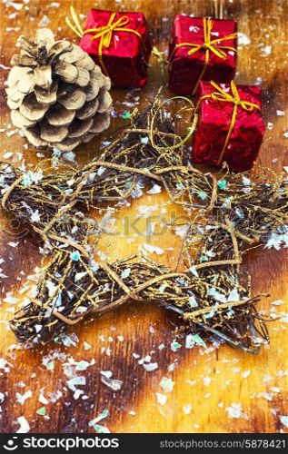 Christmas decorations. Festive Christmas decorations on wooden background in vintage style.Photo tinted.Selective focus