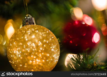 Christmas decorations, focus on ball, soft and warm christmas colours