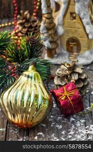 Christmas decorations from pine cones,toys on wooden background.Photo tinted