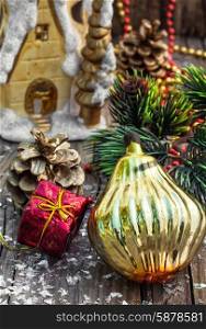 Christmas decorations from pine cones,toys on wooden background.Photo tinted
