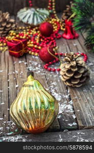 Christmas decorations from pine cones,toys on wooden background.Photo tinted