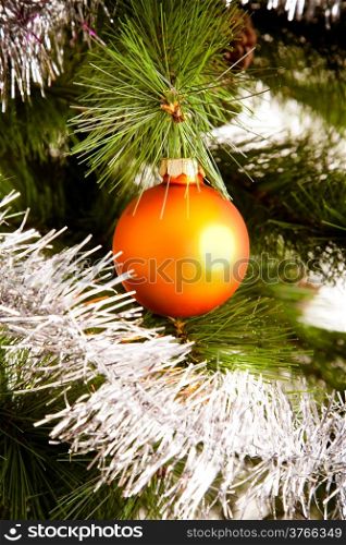 christmas decorations hanging on christmas tree