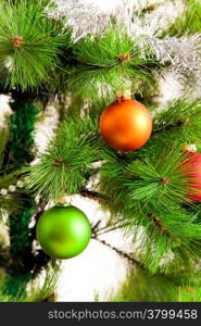 christmas decorations hanging on christmas tree