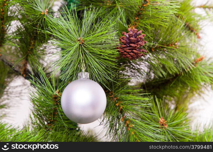 christmas decorations hanging on christmas tree