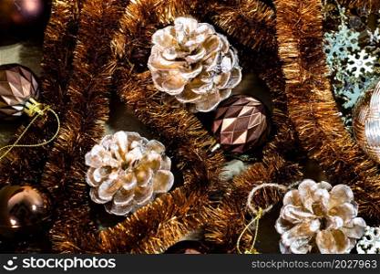 Christmas decorations in a box. Christmas concept. Christmas balls, pine cones, garlands.