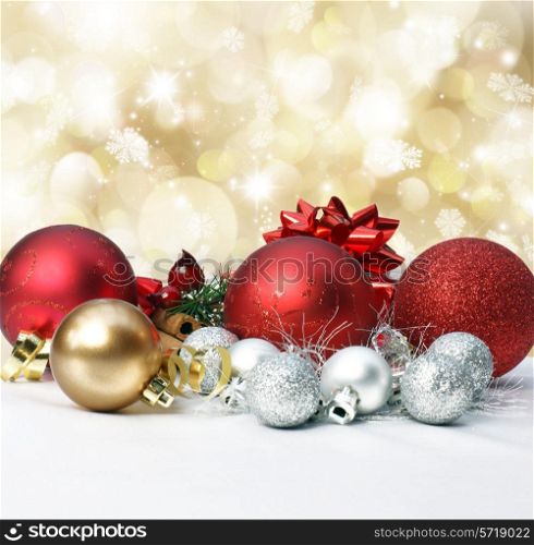 Christmas decorations on a gold background with bokeh lights and stars