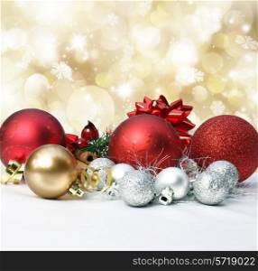 Christmas decorations on a gold background with bokeh lights and stars
