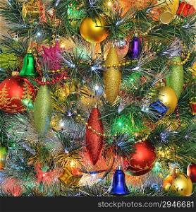Christmas decorations on Christmas tree against festive illuminations