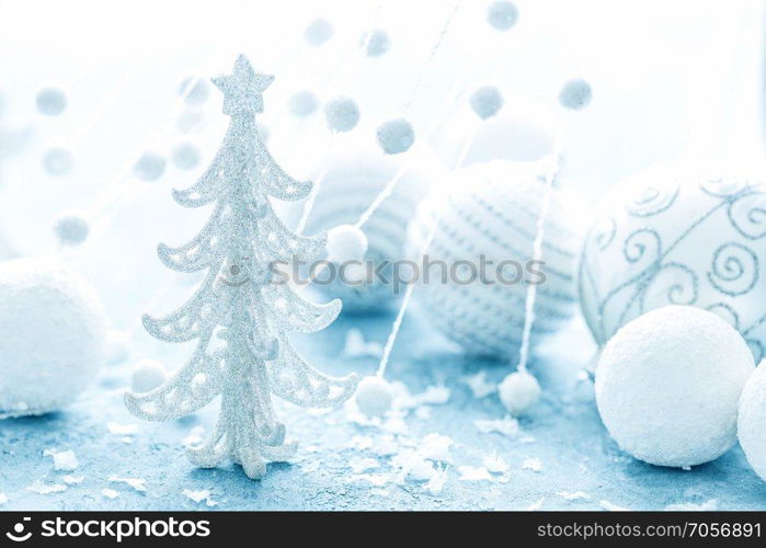 Christmas decorations on frosty background. Festive card with Christmas decorations