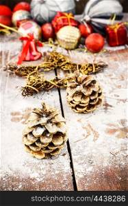 Christmas decorations on snowy wooden background