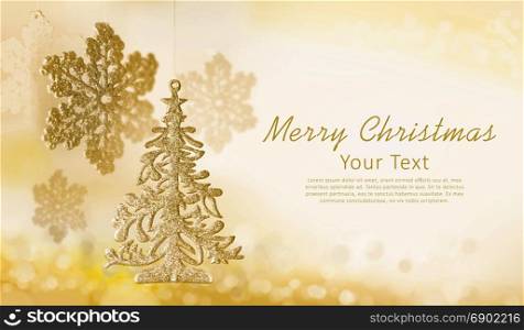 Christmas decorations snowflake, tree toy on gold background. Place for greeting text.