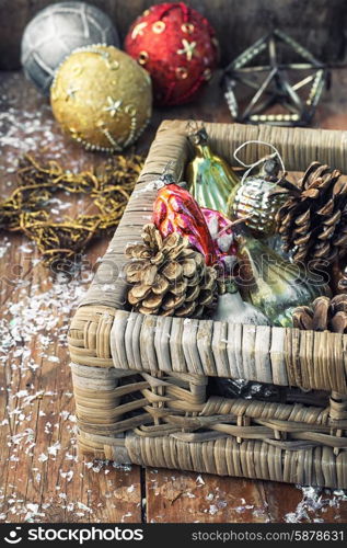 Christmas decorations. Wicker wooden box with old-fashioned Christmas toys