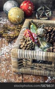 Christmas decorations. Wicker wooden box with old-fashioned Christmas toys