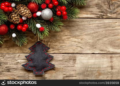 christmas decorations with ornaments on wooden background