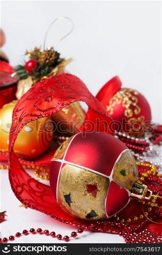 Christmas decorations with red ribbon around white background