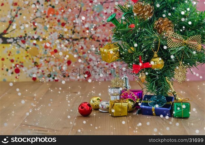 Christmas decorations with snow. Christmas background with decorations and gift boxes on wooden board