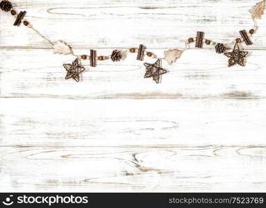 Christmas decorations wooden stars and pine cones. Holidays background. Vintage ornaments