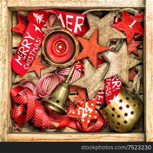 Christmas decorations wooden stars, red ribbons and burning candle. Vintage style colored picture. Merry Christmas!