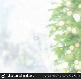 christmas defocosed background with fir tree, bokeh lights and snow. with fir tree and snow