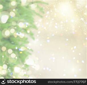 christmas defocused background with fir tree, golden bokeh lights in bakground. with fir tree and snow