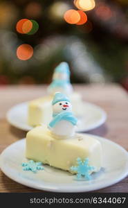 Christmas dessert with snowman. Christmas dessert with snowman on lights bokeh background