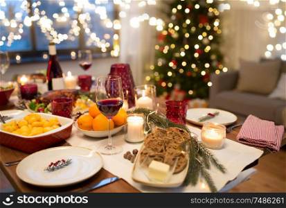 christmas dinner and eating concept - food and drinks on table at home. food and drinks on christmas table at home