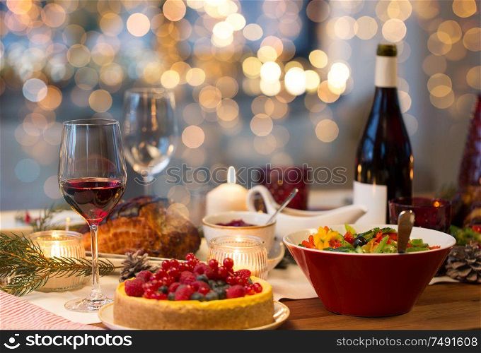 christmas dinner and eating concept - food and drinks on table at home. food and drinks on christmas table at home