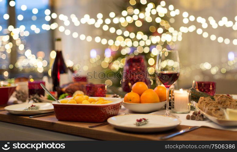 christmas dinner and eating concept - food and drinks on table at home. food and drinks on christmas table at home