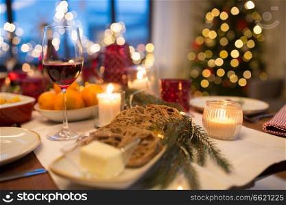 christmas dinner, food and eating concept - bread slices and other food on table. bread slices and other food on christmas table