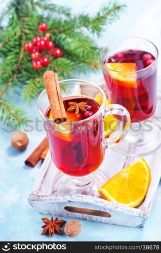 christmas drink with fruits and aroma spice