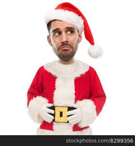 christmas, emotion, facial expressions and people concept - sad unhappy young man in santa claus costume (funny cartoon style character with big head). sad unhappy man in santa claus costume