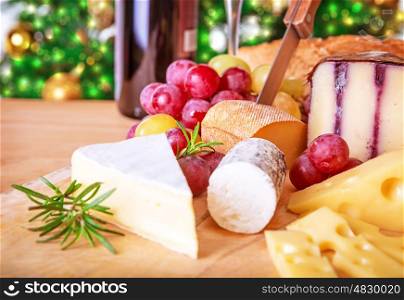 Christmas eve table, festive food still life, romantic cheese and wine set up, celebrating Xmas party at home
