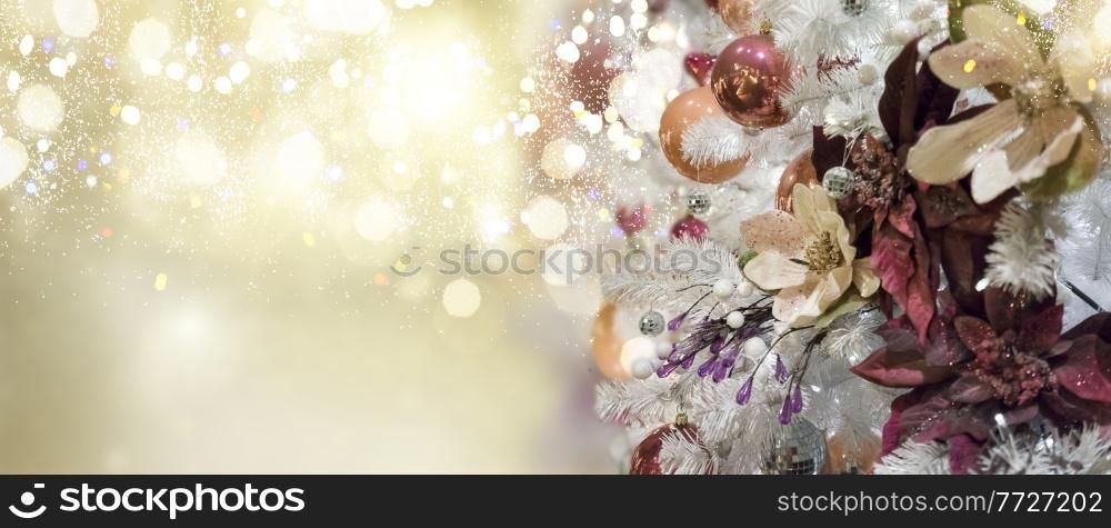 christmas evergreen fresh tree with holiday decorations and lights with copy space on magic glittering bokeh background. christmas fir tree with decorations