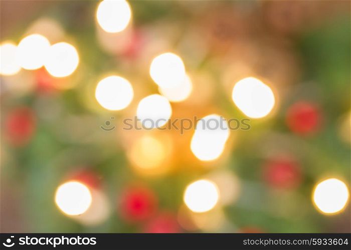 christmas fir tree with lights defocused background. christmas lights defocused background
