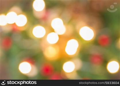 christmas fir tree with lights defocused background. christmas lights defocused background