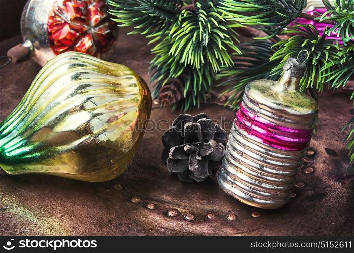Christmas fir tree with retro decoration. Old-fashioned glass soviet christmas fur-tree toys on a bronze retro background.Christmas holidays