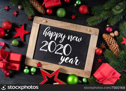 Christmas flat lay frame with red git boxes, Christmas celebration and gift giving concept, with happy new 2020 year greetings. Christmas flat lay scene with golden decorations