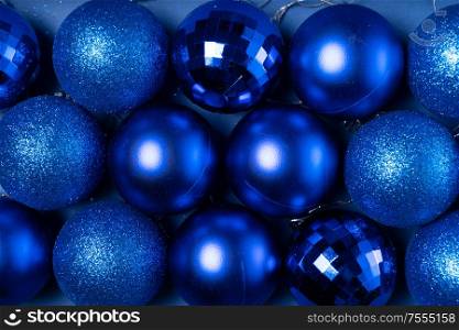 Christmas flat lay scene with glass balls close up rows in classic blue color. Christmas flat lay scene with glass balls