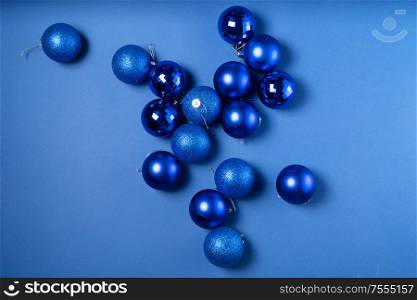 Christmas flat lay scene with glass balls in classic blue color. Christmas flat lay scene with glass balls