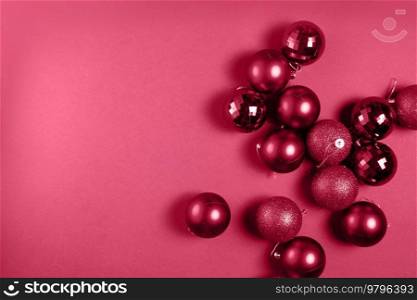 Christmas flat lay scene with glass balls in viva magenta color. Christmas flat lay scene with glass balls