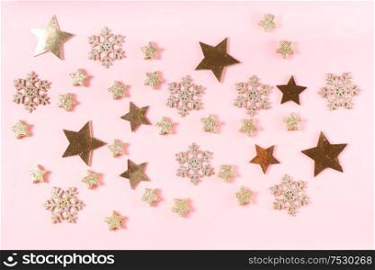 Christmas flat lay scene with golden decorations, top view on pink. Christmas flat lay scene with golden decorations