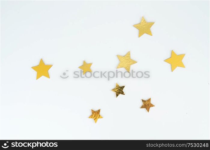 Christmas flat lay scene with golden stars, top view. Christmas flat lay scene with golden decorations