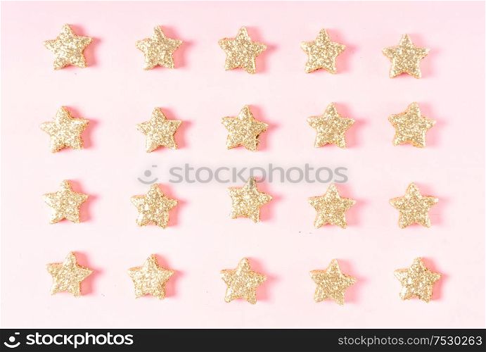 Christmas flat lay scene with golden strar decorations, top view. Christmas flat lay scene with golden decorations