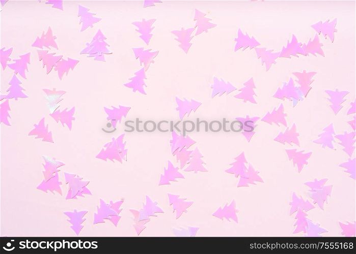 Christmas flat lay scene with pink fir tree confetti , top view over pink. Christmas flat lay scene with golden decorations