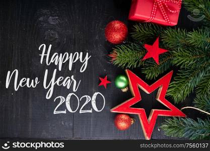 Christmas flat lay scene with red git boxes border, Christmas celebration and gift giving concept, copy space on wooden background with happy new 2020 year greetings. Christmas flat lay scene with golden decorations