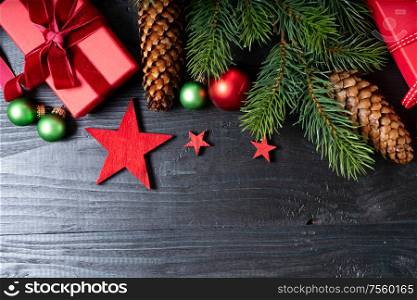 Christmas flat lay scene with red git boxes border, Christmas celebration and gift giving concept, copy space on wooden background. Christmas flat lay scene with golden decorations